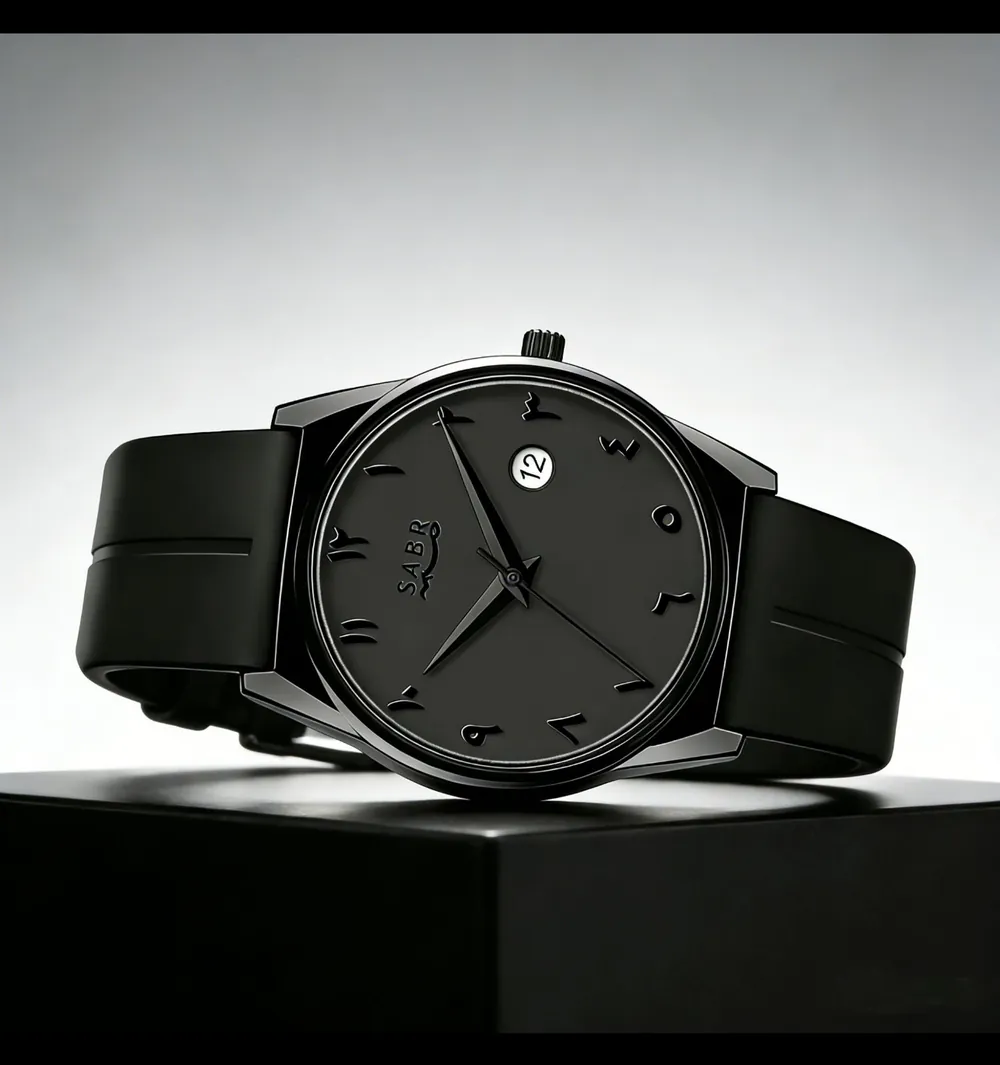 Watch resting on its black gift box